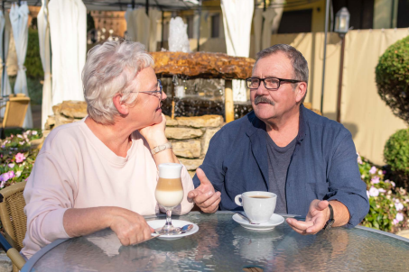 Man and woman talking over coffee